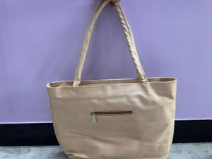 Stylish Beige Tote Bag with Cutout Design