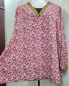 Chic Floral Print Top with Embellished Neckline