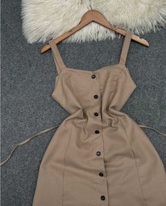 beige sleeveless A-line mini dress