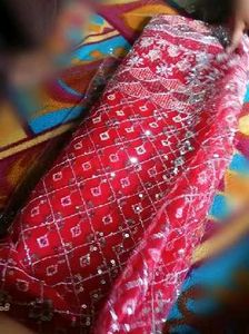 Red dress material with embroidery work