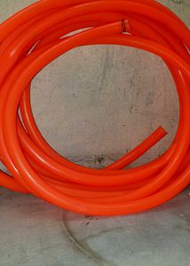 Durable Orange Hose for Various Uses