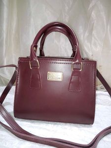 Elegant Maroon Handbag with Shoulder Strap