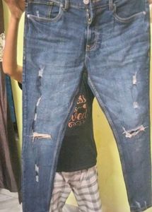 Distressed Blue Denim Jeans