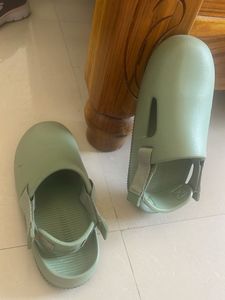 Mint Green Slides Nike brand.