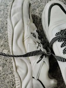 Stylish White Sneakers with Black Laces