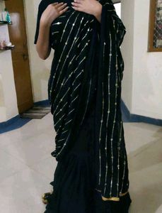 Elegant Black Saree with Golden Embellishments