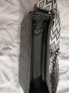 Stylish Grey Handbag with Geometric Strap