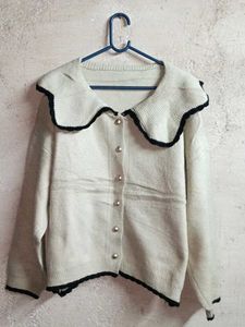 Chic Cream Knit Cardigan with Black Trim
