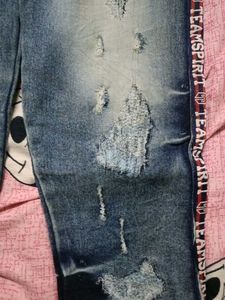 Distressed Blue Jeans with Side Stripe