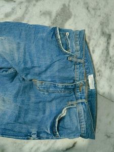 Ripped Knee Jeans