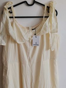 Cream Off-Shoulder Jumpsuit with Tie-Up Sleeves