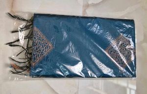 Elegant Teal Saree with Diamond Motifs