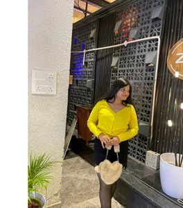 yellow top with black skirt