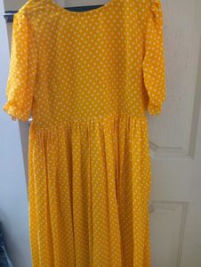 yellow long frockwith white dots