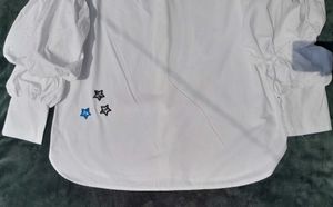 White balloon-sleeve shirt.