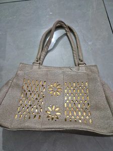Elegant Grey Handbag with Gold Accents