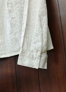 White eyelet ruffle long sleeve top