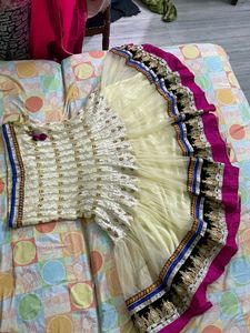 cream colour embroidered  heavy border  full flared lehnga with net heavy border dupatta