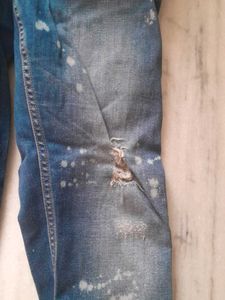 Distressed Blue Jeans with Paint Splatter