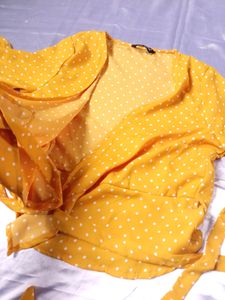 polka dot yellow wrap top.