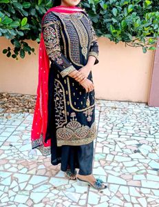 Elegant Black Kurta Set with Intricate Gold Embroi