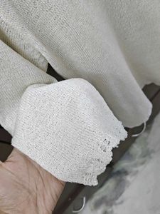 Chic White Knit Top with Lady Detail