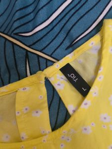 A Yellow Colour Top With Frills In The Front