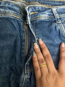 Distressed Blue Denim Jeans