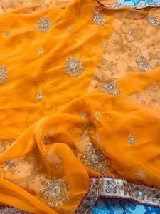 Exquisite Orange Saree with Embellishments