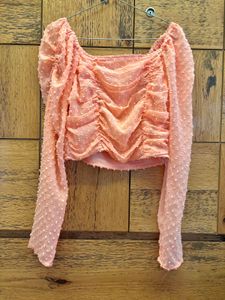 pink ruffled long sleeve crop top