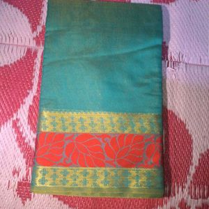 Beautiful Teal Saree with Red Border