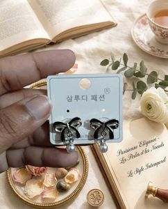 Chic Bow & Pearl Dangle Earrings