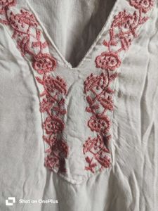 Off-white kurta with pink embroidery.y