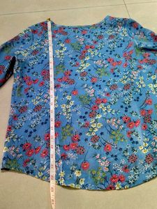 Blue floral ditsy- print top. (Material: Not sure)