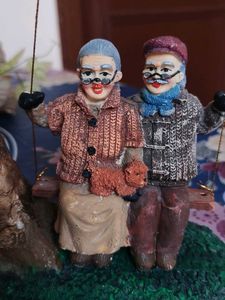 Vintage Couple on Swing Figurine