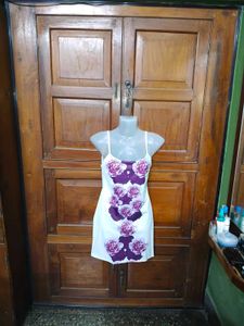 White dress with purple floral print