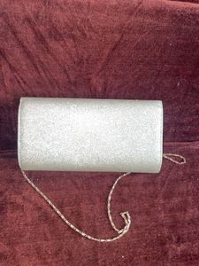 Sparkling Silver Clutch cum sling with chain👛
