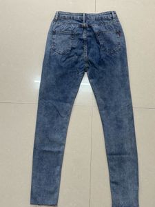 Distressed Blue Denim Jeans