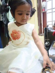 Adorable Girls' Cream Dress with Floral Accent