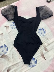 Chic Black Bodysuit with Sheer Puff Sleeves