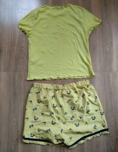 Only brand top with cute yellow shorts.