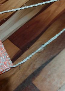 beautiful stylish orange and white colour sling ba