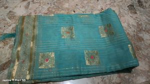 Beautiful Teal Saree with Gold Border