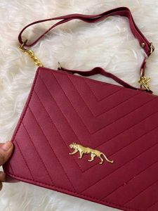 sabhyasachi Red Handbag with Gold Tiger Accent