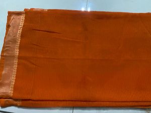 Elegant Orange Saree with Golden Border and  uns