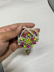 Pearl bracelet with attached ring
