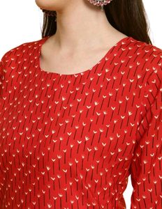 Red printed kurta with matching nail polish