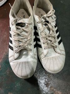 White Sneakers with Black Stripes