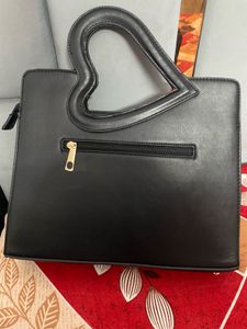 Stylish Black Handbag with Heart Handle