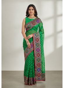 a printed saree with net in green color which look